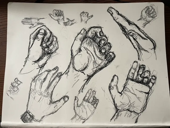 Page of pencil hand studies in different poses