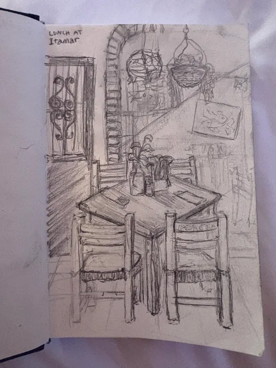 Pencil sketch of a restaurant table and chairs beneath an arched doorway and a hanging lamp