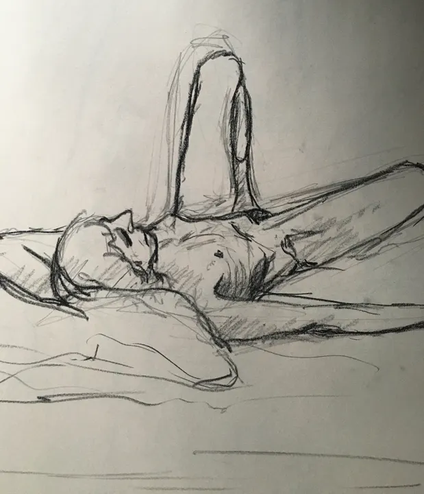 Charcoal life drawing of a reclining nude figure with a raised knee
