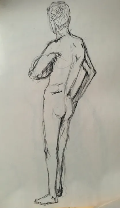 Charcoal life drawing of a standing nude figure seen from behind