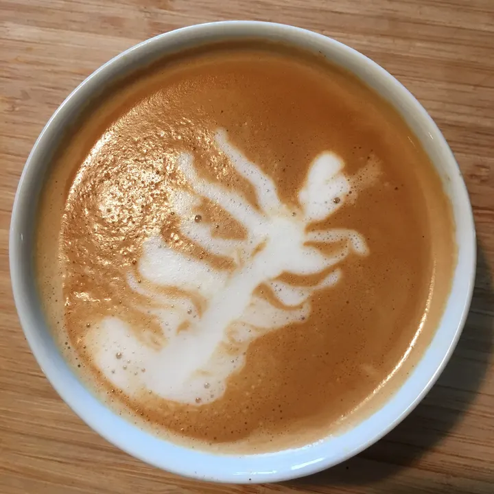 A wobbly, sprawling rosetta in a white ceramic cup