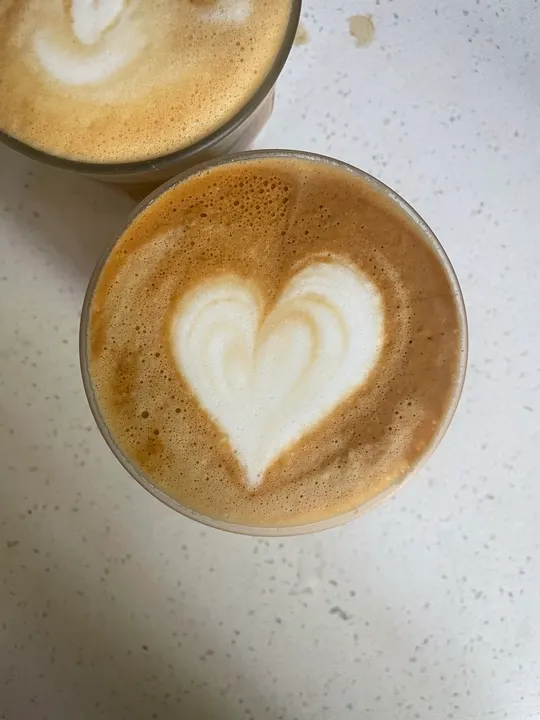 A clean, full heart in a glass, another cup beside it