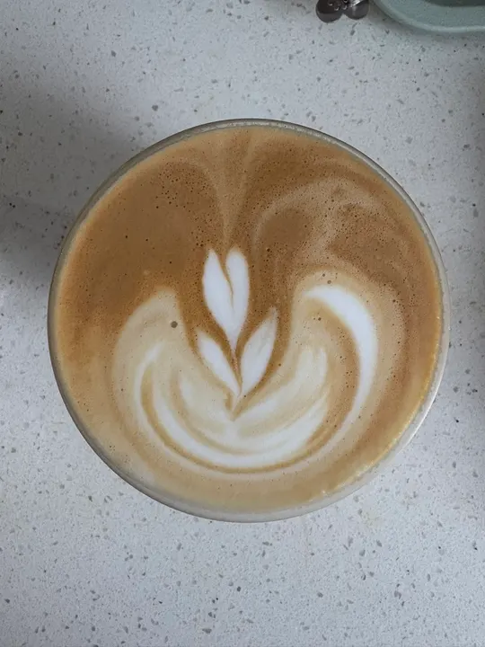 A tulip with a slim tip rising through it
