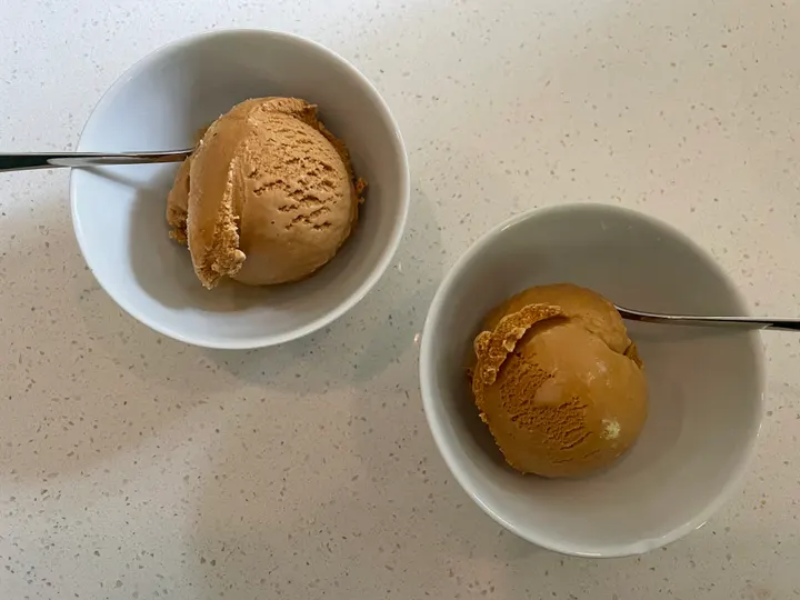 Two bowls of coffee-coloured ice cream
